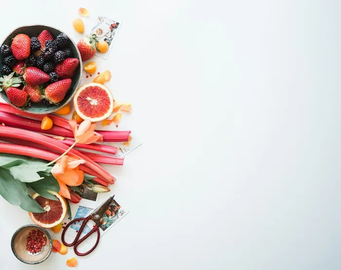 Fresh fruit arranged on a clean surface, part of a protein-and-produce balanced plate