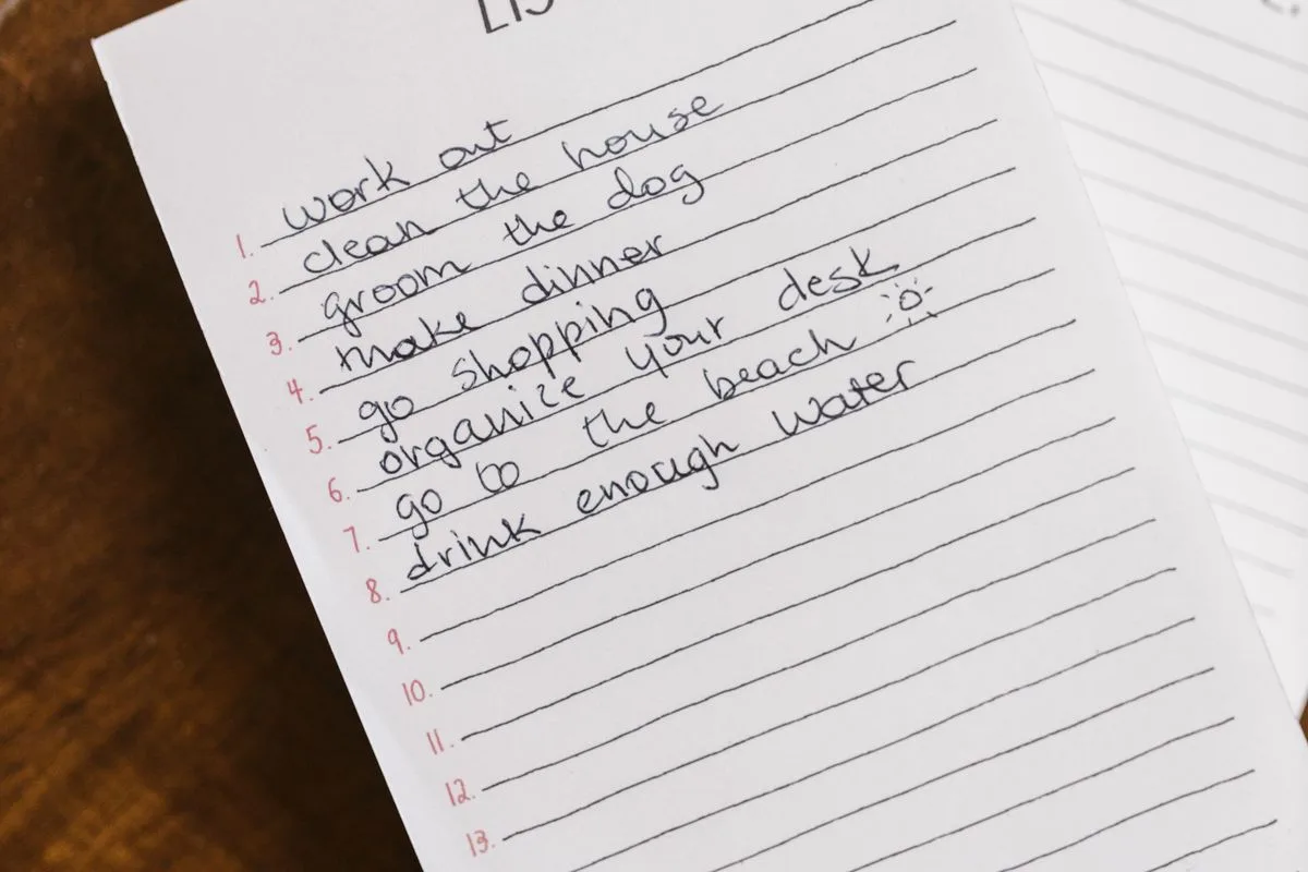 A handwritten list of daily habits including work out and drink enough water